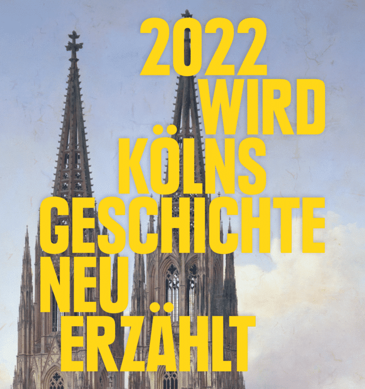 Das Bild zeigt die spitzen des Kölner Doms. Im Vordergrund ist der Text "2022 wird Kölns Geschichte neu erzählt" zu lesen.